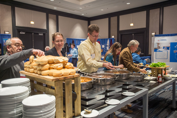Symposium attendees helping themselves to refreshments